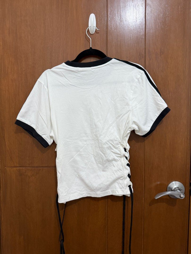 ADIDAS Laced-Up T-Shirt (Category: Shirts) located in Pasay City. Submitted by nh.declutter (Listing ID 1359386646, Image 2). Description: PLEASE READ: - Posted price is LAST PRICE. Lowballers will not be entertained. - No when worn pictures. - Item color may vary slightly due to lighting. - All items LISTED WITH BRANDS are GUARANTEED AUTHENTIC and bought by the seller either from the website of the said brand or from the mall. PRODUCT DETAILS: -