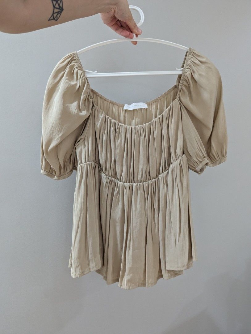 Dainty blouse (beige) freesize (Category: Blouses) located in Quezon City. Submitted by FAYNT (Listing ID 1359368743, Image 1). Description: Bought at hellomilktea @ Hong Kong (boutique store) size is freesize. worn once! will fit small to medium..