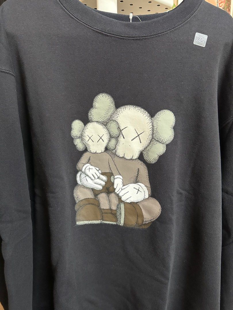 FS: Uniqlo x Kaws Sweatshirt (Category: Coats, Jackets and Outerwear) located in Paranaque City. Submitted by daluho.stuff (Listing ID 1359337198, Image 1). Description: Available Sizes: L, XL Color: Black.