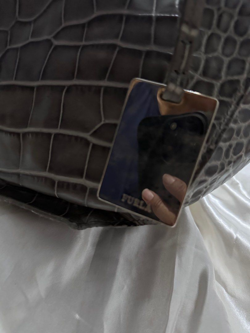 Furla Crocs Bag (Category: Luxury Bags & Wallets) located in Quezon City. Submitted by decluttertherapymnl (Listing ID 1359313534, Image 3). Description: For Sale Furla Crocs Hand Bag Authentic and brought home from LA No box, just dustbag. RFS: Declutter Pick up at Pasig Payment thru Bank o E-Cash.