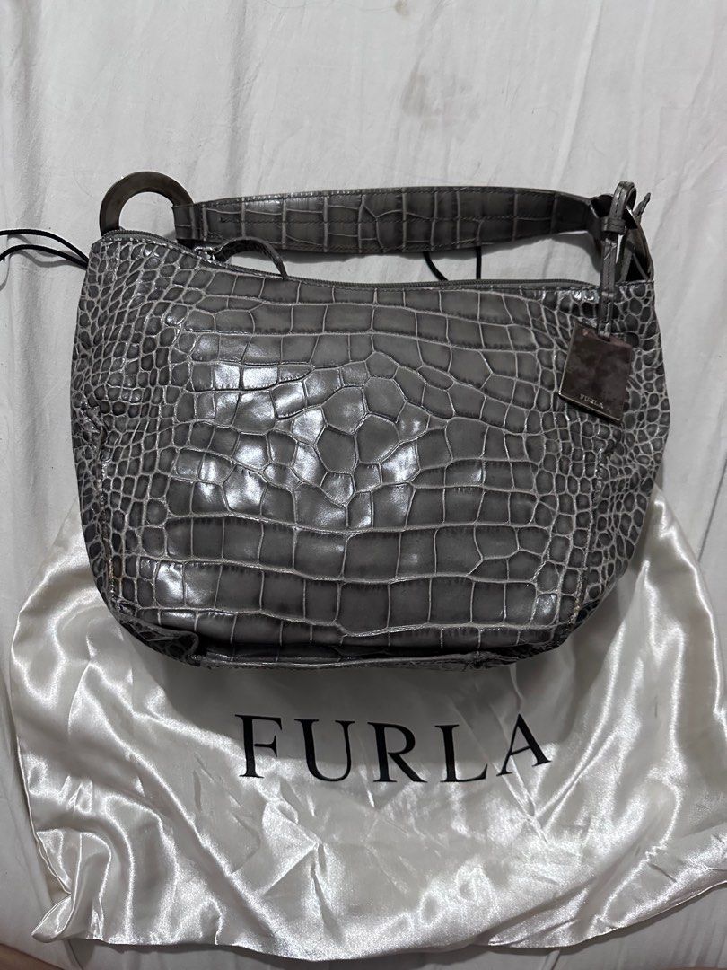 Furla Crocs Bag (Category: Luxury Bags & Wallets) located in Quezon City. Submitted by decluttertherapymnl (Listing ID 1359313534, Image 1). Description: For Sale Furla Crocs Hand Bag Authentic and brought home from LA No box, just dustbag. RFS: Declutter Pick up at Pasig Payment thru Bank o E-Cash.