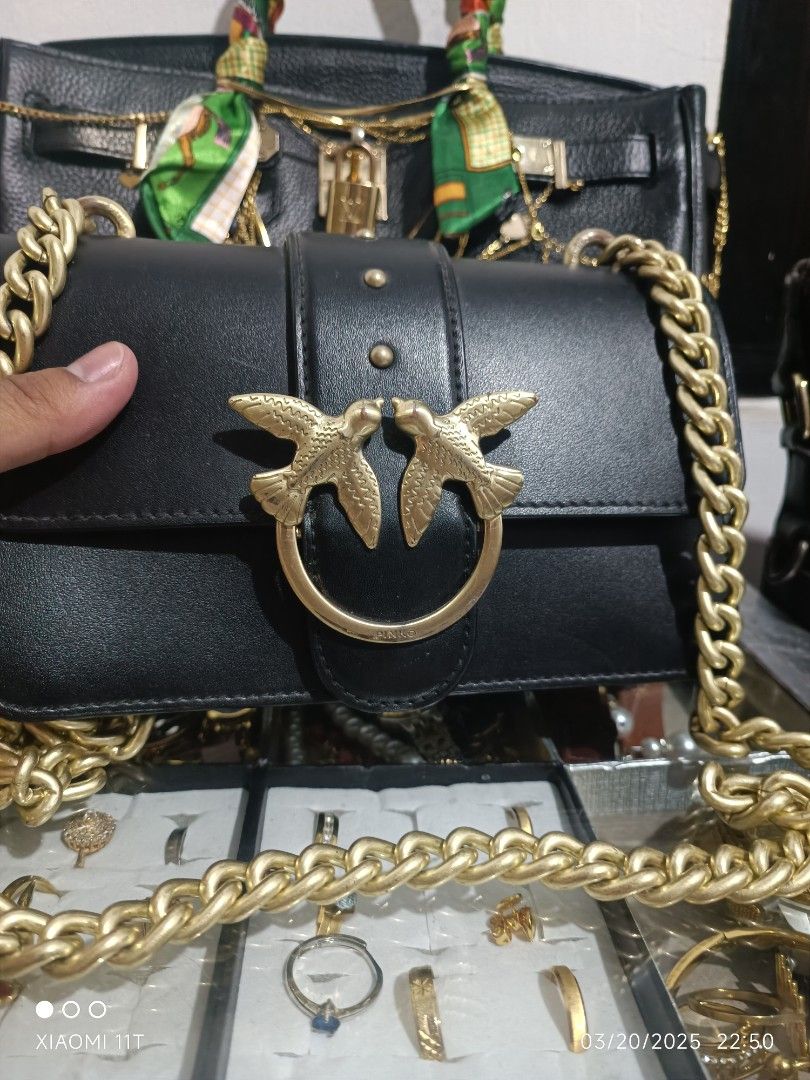Pinko sling bag (Category: Luxury Bags & Wallets) located in Bayombong. Submitted by kweeeen (Listing ID 1359484400, Image 2). Description: Authentic Pinko sling bag with etiketa sobrang gold pa ng hardware and sling.