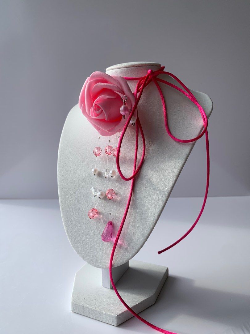 SAINTY Pink Rose Cord Necklace (Category: Necklaces) located in Marikina City. Submitted by aimamor (Listing ID 1359441385, Image 2). Description: Pink Rose Cord Necklace | Perfect for Summer All handmade and carefully assembled 🤲🏻 • Rubber Flower Rose • Beautiful bead drops Orchid Size: • Cord: 51”.