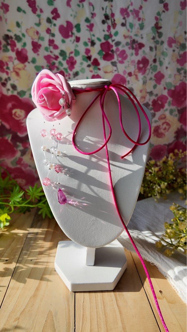 SAINTY Pink Rose Cord Necklace (Category: Necklaces) located in Marikina City. Submitted by aimamor (Listing ID 1359441385, Image 3). Description: Pink Rose Cord Necklace | Perfect for Summer All handmade and carefully assembled 🤲🏻 • Rubber Flower Rose • Beautiful bead drops Orchid Size: • Cord: 51”.