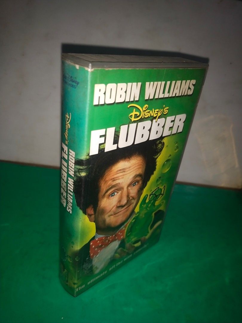 Vintage "FLUBBER" movie/VHS/yr.1998/Viva Video (Category: Vintage Collectibles) located in Del Monte. Submitted by zurckram777 (Listing ID 1359379093, Image 3). Description: "FLUBBER" movie on VHS format Starring Robin Williams. Made by Viva Video in 1998. Untested,but at least na fast forward and rewind ko ito. Has no "amag" sa taas ng mga spool. Pwedeng i display na lang ito along with your Robin Williams collection. Case and tape are in VG pre
