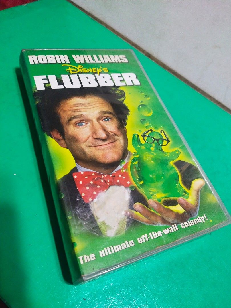 Vintage "FLUBBER" movie/VHS/yr.1998/Viva Video (Category: Vintage Collectibles) located in Del Monte. Submitted by zurckram777 (Listing ID 1359379093, Image 1). Description: "FLUBBER" movie on VHS format Starring Robin Williams. Made by Viva Video in 1998. Untested,but at least na fast forward and rewind ko ito. Has no "amag" sa taas ng mga spool. Pwedeng i display na lang ito along with your Robin Williams collection. Case and tape are in VG pre