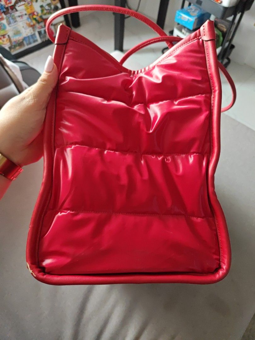 Authentic Kate Spade Ella Extra Large Puffy Tote Bag in Red (Category: Luxury Bags & Wallets) located in Quezon City. Submitted by ohitsyel (Listing ID 1359546228, Image 2). Description: Authentic Kate Spade Ella Extra Large Puffy Tote Bag in Red Selling for 6k‼️‼️ reduced to 4k ‼️ see photo for small flaw hence selling low MOP: Gcash/BDO Shipping: Grab/Lalamove/LBC Can do meetup around Scout Area, Quezon City.