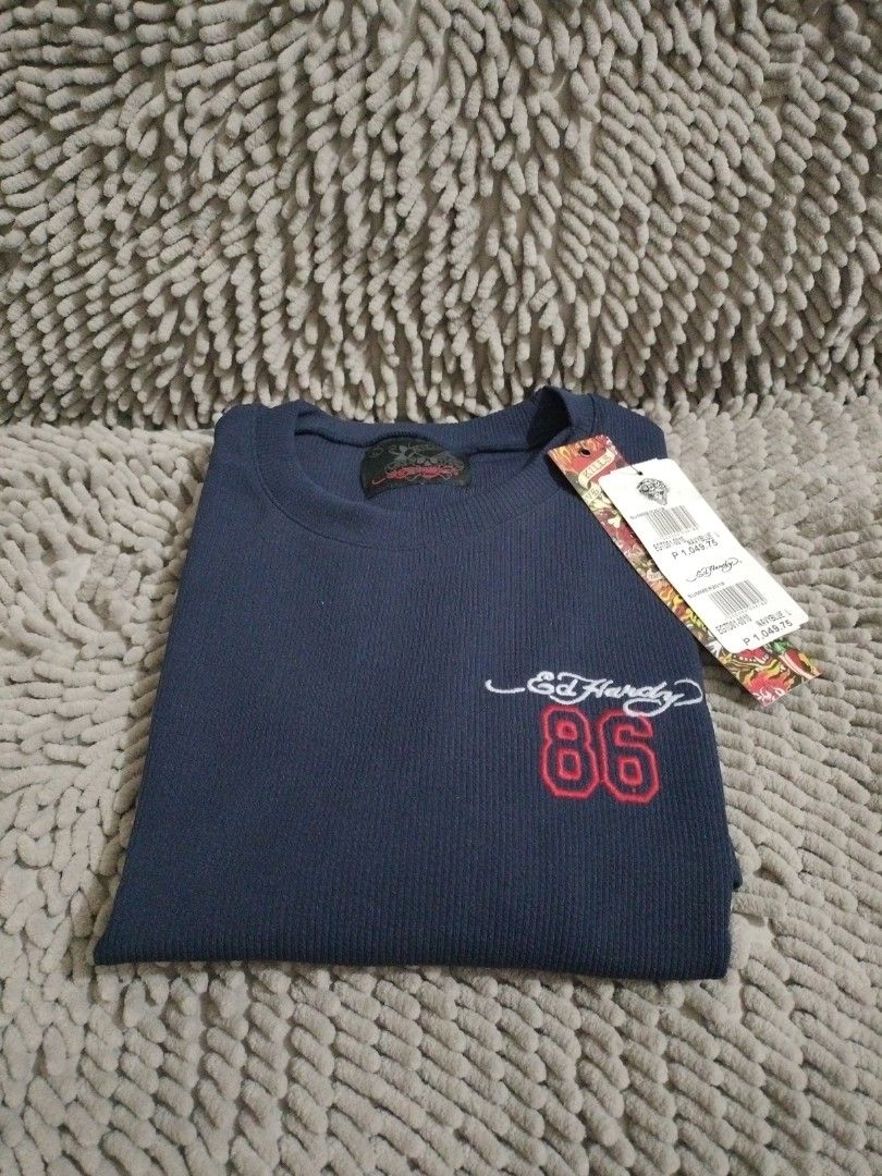 ED HARDY JERSEY RIBBED DRESS (Category: Dresses) located in Mandaluyong City. Submitted by letgoph (Listing ID 1359630500, Image 1). Description: PLEASE READ WITH UNDERSTANDING. BRAND: ED HARDY Style: JERSEY RIBBED DRESS DEETS: For Women Size: L on tag Dimension: 18 inches chest 17 inches waist 32 inches length 7.5 inches sleeves Color: Navy blue with embroidered logo front and red double stripes on sleeves Fabric: Cotton Rib BNWT FLAW/S: None IN
