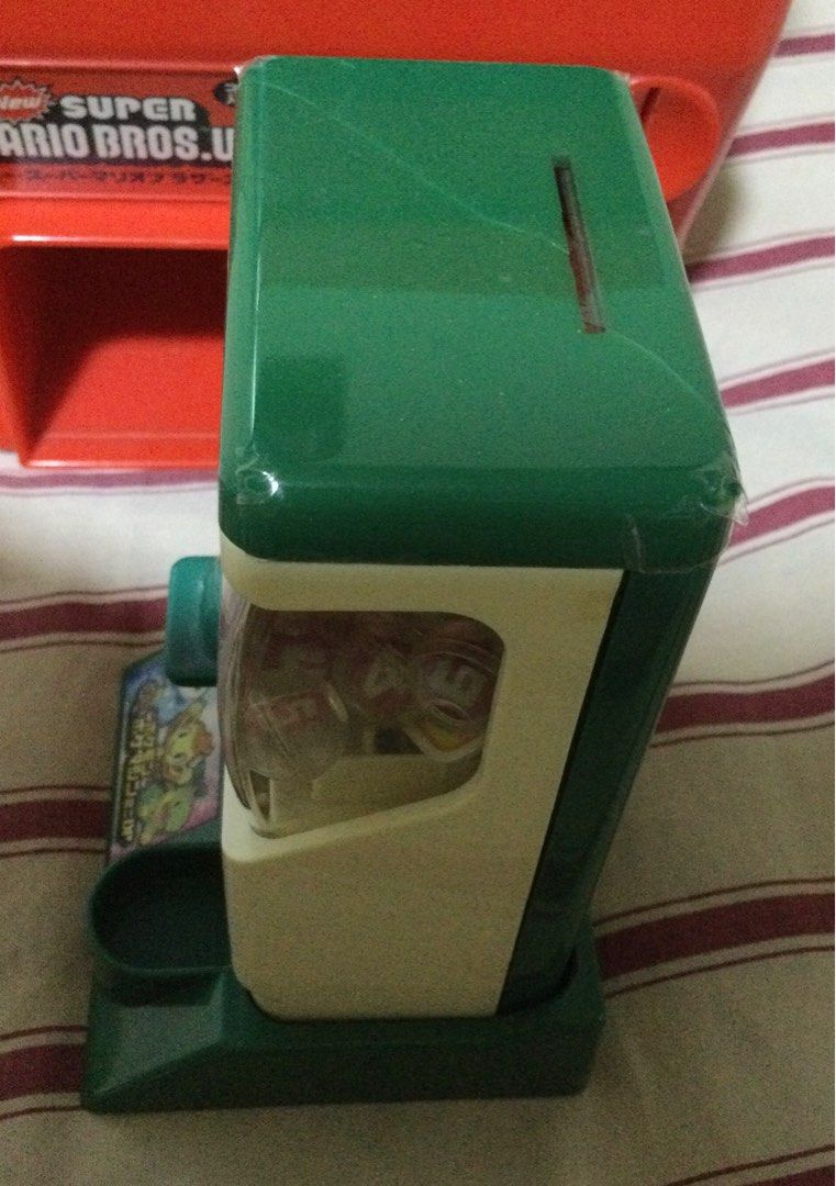 Nintendo Gacha Machine Bundle (Super Mario and Pokémon) (Category: Character Goods) located in Tanay. Submitted by the4thram (Listing ID 1359570375, Image 3). Description: This is a bundled listing, it includes: Super Mario Gacha Machine toy Dragon Ball Z gashapon capsule toy (sealed) Hello Kitty gashapon capsule toy Gintama gashapon capsule toy Omeng Estanislao golden sheep toy Pokémon mini Gacha machine toy (please check photo for lid defect) T