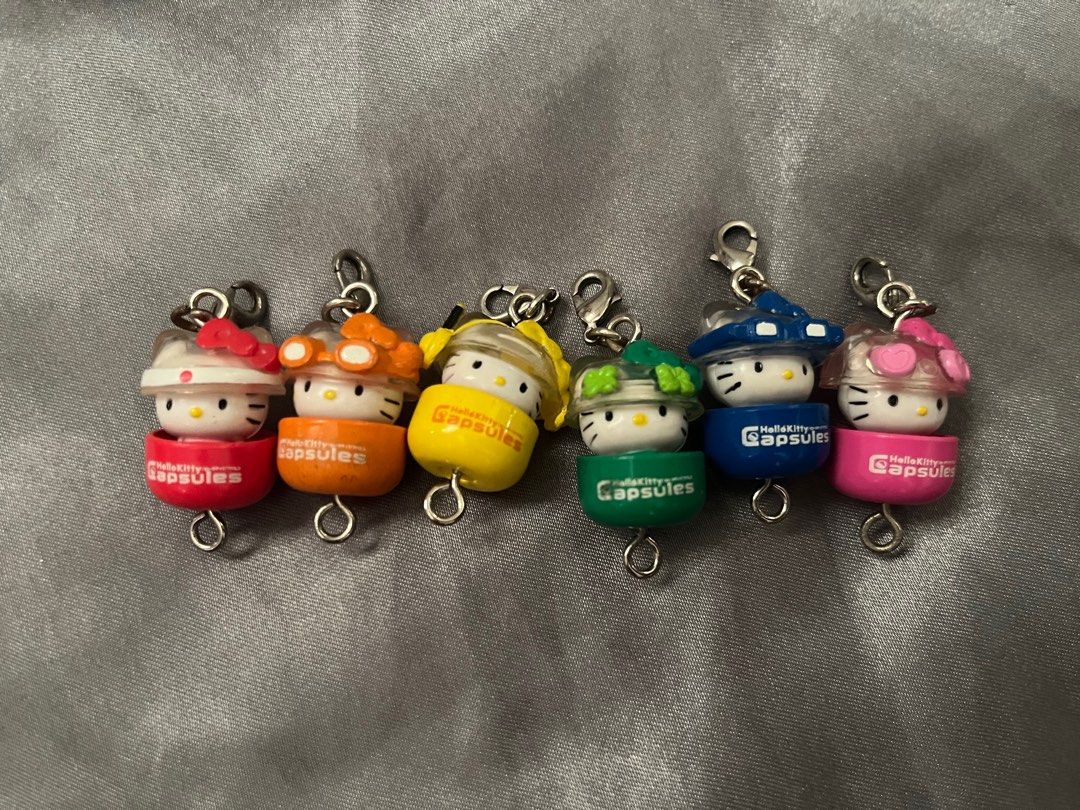 Bandai Hello Kitty Capsules 2004 (Category: Character Goods) located in Binan City. Submitted by tring_ (Listing ID 1359700916, Image 2). Description: Bandai Hello Kitty Capsules 2004 Opened: 2.3 x 1.5 cm Closed: 1.8 x 1.5 cm 6 pieces Orange and green has some dirt spots RFS: downsizing my collection Payment via Gcash Shipping is through J&T Express 🤍 .