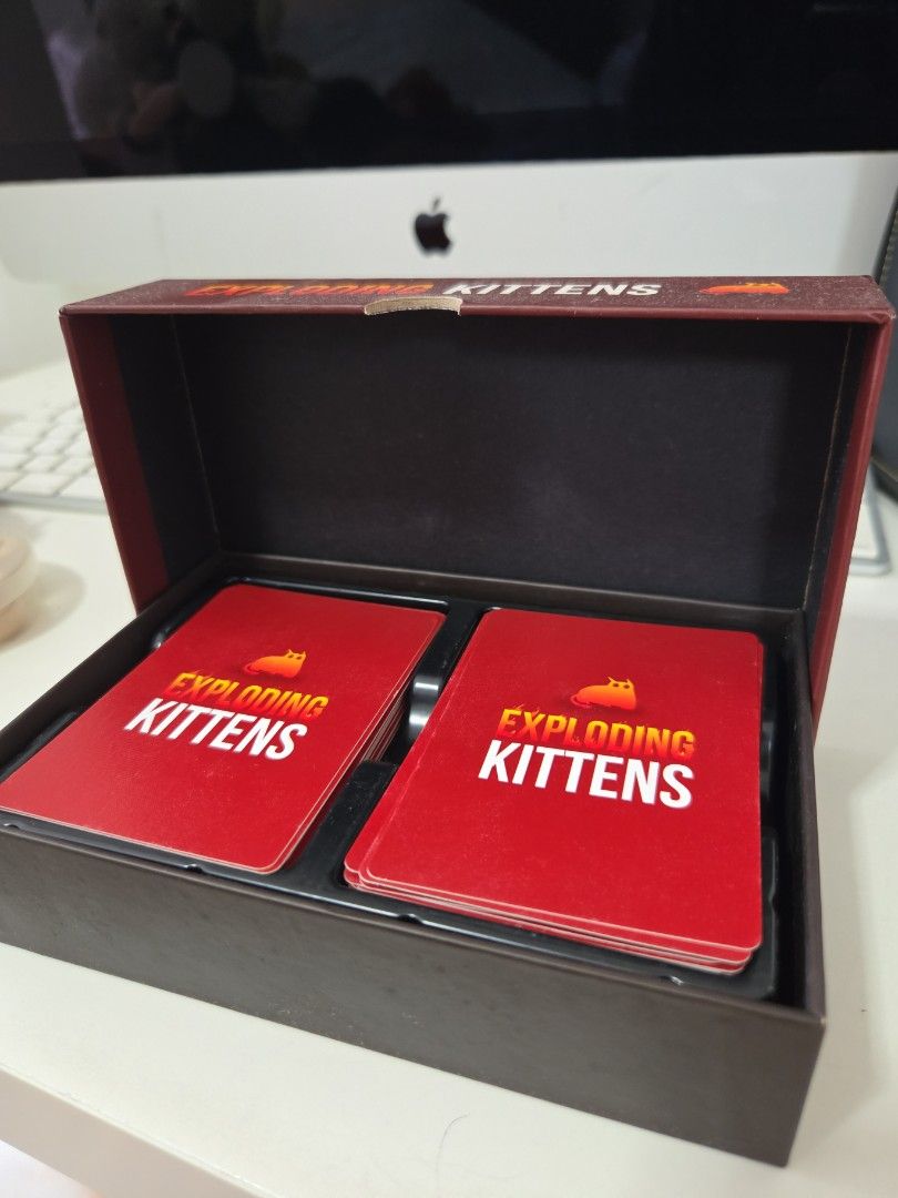 Exploding Kittens (Category: Board Games & Puzzles) located in Singapore. Submitted by teckitoo (Listing ID 1359680006, Image 2). Description: rarely used. garage sale as cleaning house yours for 5.