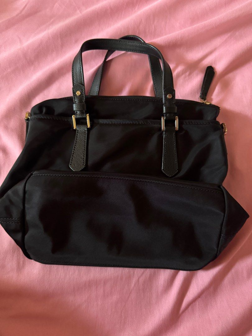 Kate Spade Nylon Sling Bag (Category: Luxury Bags & Wallets) located in Las Pinas. Submitted by sincerelyfel (Listing ID 1359704876, Image 2). Description: 8/10 condition Size: Small Model: Taylor Issue: loose thread/nawala tahi lang dun sa isang pocket. Pwede naman mapatahi RFS: hindi na nagagamit .