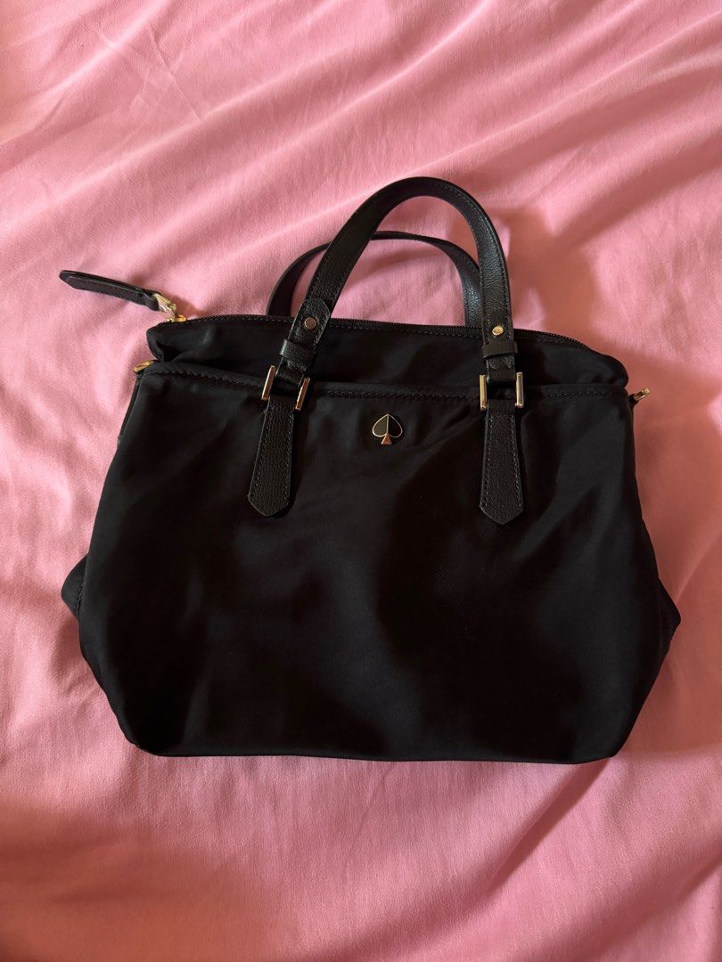 Kate Spade Nylon Sling Bag (Category: Luxury Bags & Wallets) located in Las Pinas. Submitted by sincerelyfel (Listing ID 1359704876, Image 1). Description: 8/10 condition Size: Small Model: Taylor Issue: loose thread/nawala tahi lang dun sa isang pocket. Pwede naman mapatahi RFS: hindi na nagagamit .
