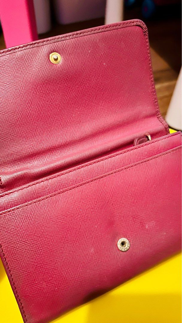 PRADA PINK SAFFIANO WRISTLET (Category: Luxury Bags & Wallets) located in San Juan City. Submitted by msbhevy (Listing ID 1359660833, Image 2). Description: Description: Selling my well-loved Prada Pink Saffiano Wristlet. 100% authentic. Perfect for carrying essentials like cash, cards, and small items. Classic saffiano leather makes it durable and stylish. Condition: Used, with signs of wear (please check photos) but still in good condition. Zip