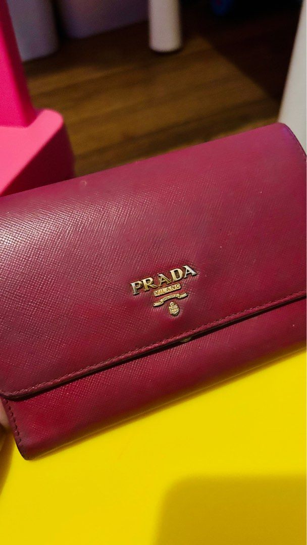 PRADA PINK SAFFIANO WRISTLET (Category: Luxury Bags & Wallets) located in San Juan City. Submitted by msbhevy (Listing ID 1359660833, Image 1). Description: Description: Selling my well-loved Prada Pink Saffiano Wristlet. 100% authentic. Perfect for carrying essentials like cash, cards, and small items. Classic saffiano leather makes it durable and stylish. Condition: Used, with signs of wear (please check photos) but still in good condition. Zip
