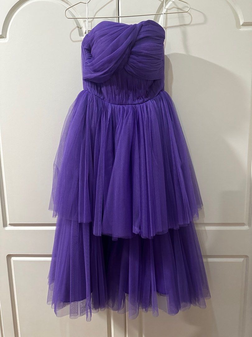 Purple tulle dress (Category: Evening dresses & gowns) located in Quezon City. Submitted by declutter___mnl (Listing ID 1359752370, Image 1). Description: Never used Measurements Bust 29” Waist 24” Comes with another layer of skirt para mukhang mahaba! Selling low Perfect for prom.