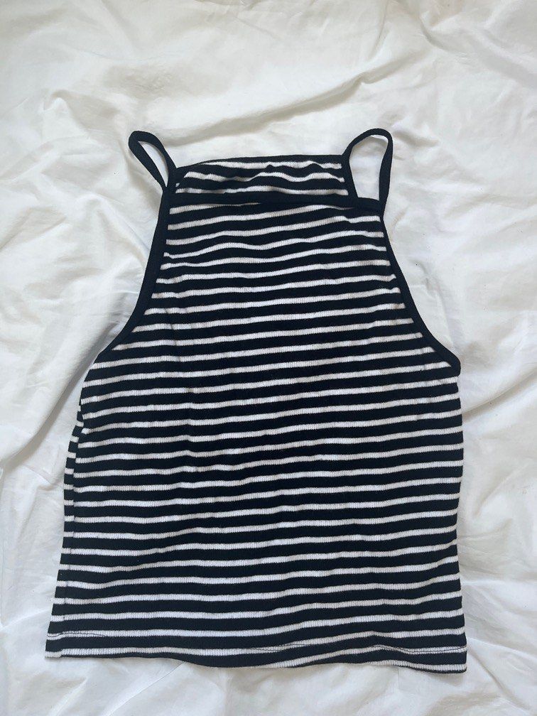 Black and white striped ribbed sleeveless (Category: Sleeveless) located in Manila. Submitted by sofiaalte (Listing ID 1359880800, Image 1). Description: Great basic piece can be paired with anything. Fits XS-S.