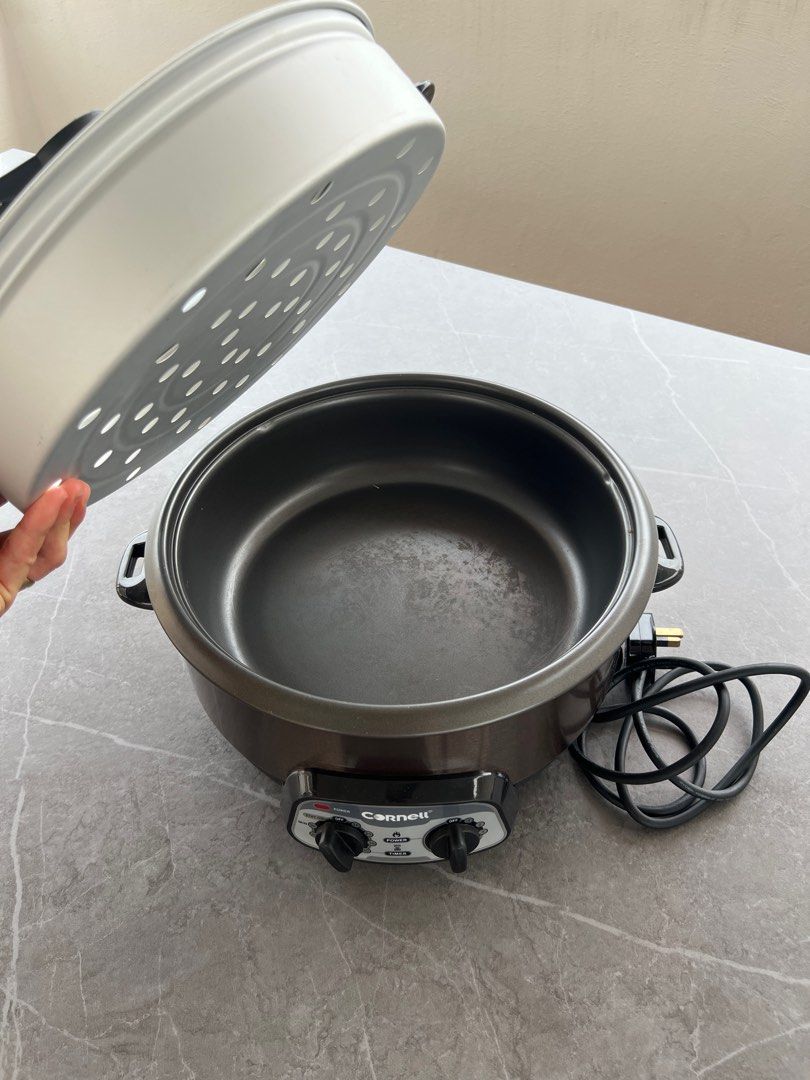 Cornell Multi-function Cooker (Category: Cookers) located in Singapore. Submitted by 24wheels (Listing ID 1359873838, Image 3). Description: This is a Cornell multi-function cooker that is 2 years old. It is in very good condition and works well. It can be used for steamboat steaming, cooking soup, and many other functions. It comes with a glass lid and a steamer basket..