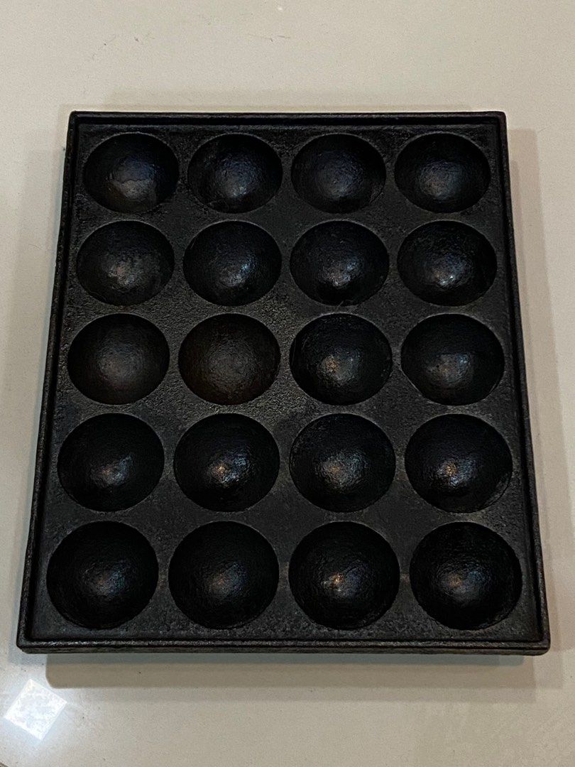 Japan Cast iron takoyaki pan (Category: Fryers) located in San Juan City. Submitted by steve.steve4 (Listing ID 1359856678, Image 1). Description: Item Description: This is a cast iron takoyaki pan, a specialized cooking tool used to make takoyaki (Japanese octopus balls) or other spherical snacks. Specifications: • Material: Cast iron (excellent heat retention and even cooking) • Number of Molds: 20 round molds • Mold Size: Each cavity is typica