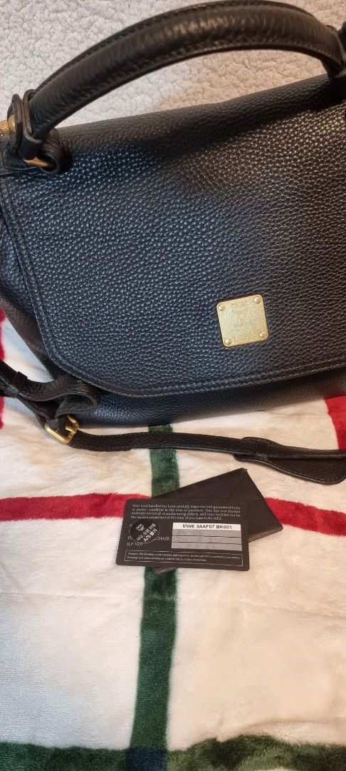 MCM Milla leather 2-way bag (Category: Luxury Bags & Wallets) located in Quezon City. Submitted by kishey (Listing ID 1359998855, Image 1). Description: with authenticity card price drop - moving out sale.