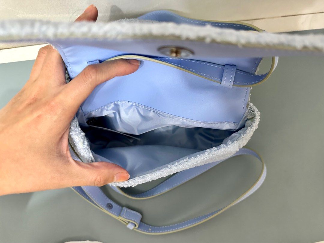 Pre-loved H&M Sky Blue Sling Bag (Category: Purses & Pouches) located in Quezon City. Submitted by trishystuff (Listing ID 1359930380, Image 2). Description: Disclaimer: - Color might be slightly different from actual due to camera/screen settings. Mode of payment: Bank transfer or Gcash Note: Shipping via Grab or Lalamove ONLY. Fee care of buyer. .
