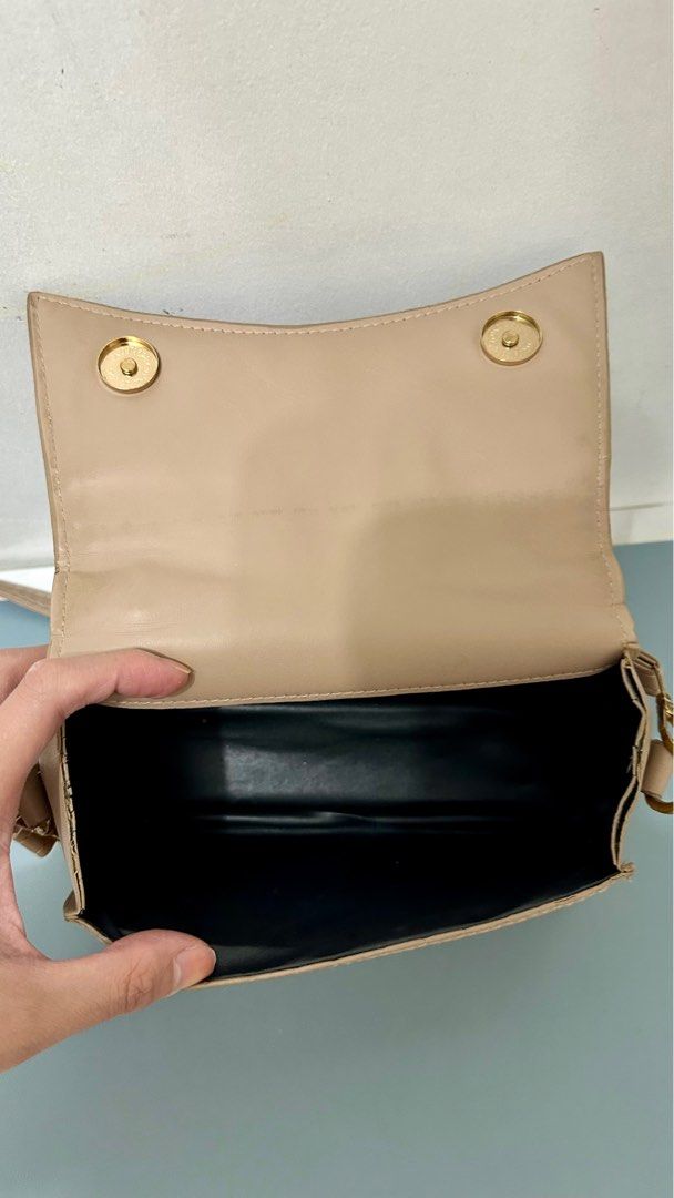 Pre-loved Shein Beige Sling Bag (Category: Cross-body Bags) located in Quezon City. Submitted by trishystuff (Listing ID 1359941133, Image 3). Description: Disclaimer: - Color might be slightly different from actual due to camera/screen settings. Mode of payment: Bank transfer or Gcash Note: Shipping via Grab or Lalamove ONLY. Fee care of buyer..