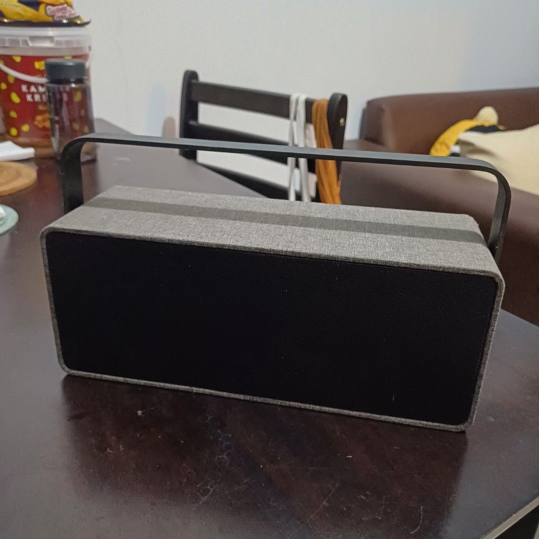 Retro Portable Bluetooth Speaker (Category: Portable Audio Accessories) located in Quezon City. Submitted by bikenbake (Listing ID 1359985807, Image 1). Description: Grey and black bluetooth speaker. Micro-USB charging port..