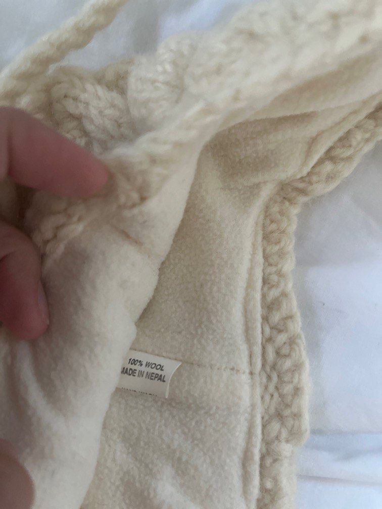 White 100% Wool Knitted Hat/Beanie (from Nepal) (Category: Hats & Beanies) located in Manila. Submitted by sofiaalte (Listing ID 1359871706, Image 2). Description: Made in Nepal 100% Wool. Really warm with cute strings. For small heads! .