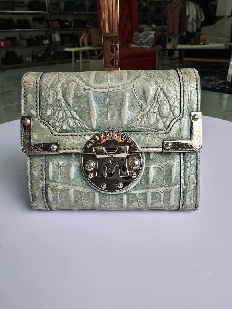 Authentic Metrocity small wallet (Category: Luxury Bags & Wallets) located in Quezon City. Submitted by jhaediah (Listing ID 1360122475, Image 1). Description: - Authentic 💯 - Metrocity small wallet + shipping fee ✅.