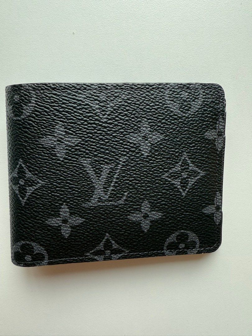 LV multiple wallet - Monogram eclipse (Category: Bags & Wallets) located in Singapore. Submitted by leessang (Listing ID 1360104978, Image 2). Description: I’m selling a lightly used Louis Vuitton Multiple Wallet - Monogram eclipse, purchased in Paris. It features multiple card slots and compartments, making it both stylish and functional for everyday use. Lightly used and No receipt available. Includes: Box and dustbag as shown Feel free to mess