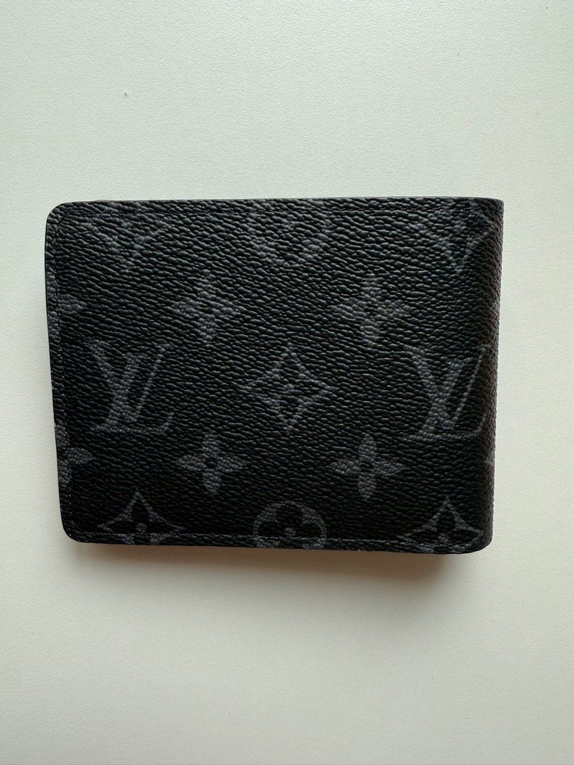 LV multiple wallet - Monogram eclipse (Category: Bags & Wallets) located in Singapore. Submitted by leessang (Listing ID 1360104978, Image 3). Description: I’m selling a lightly used Louis Vuitton Multiple Wallet - Monogram eclipse, purchased in Paris. It features multiple card slots and compartments, making it both stylish and functional for everyday use. Lightly used and No receipt available. Includes: Box and dustbag as shown Feel free to mess