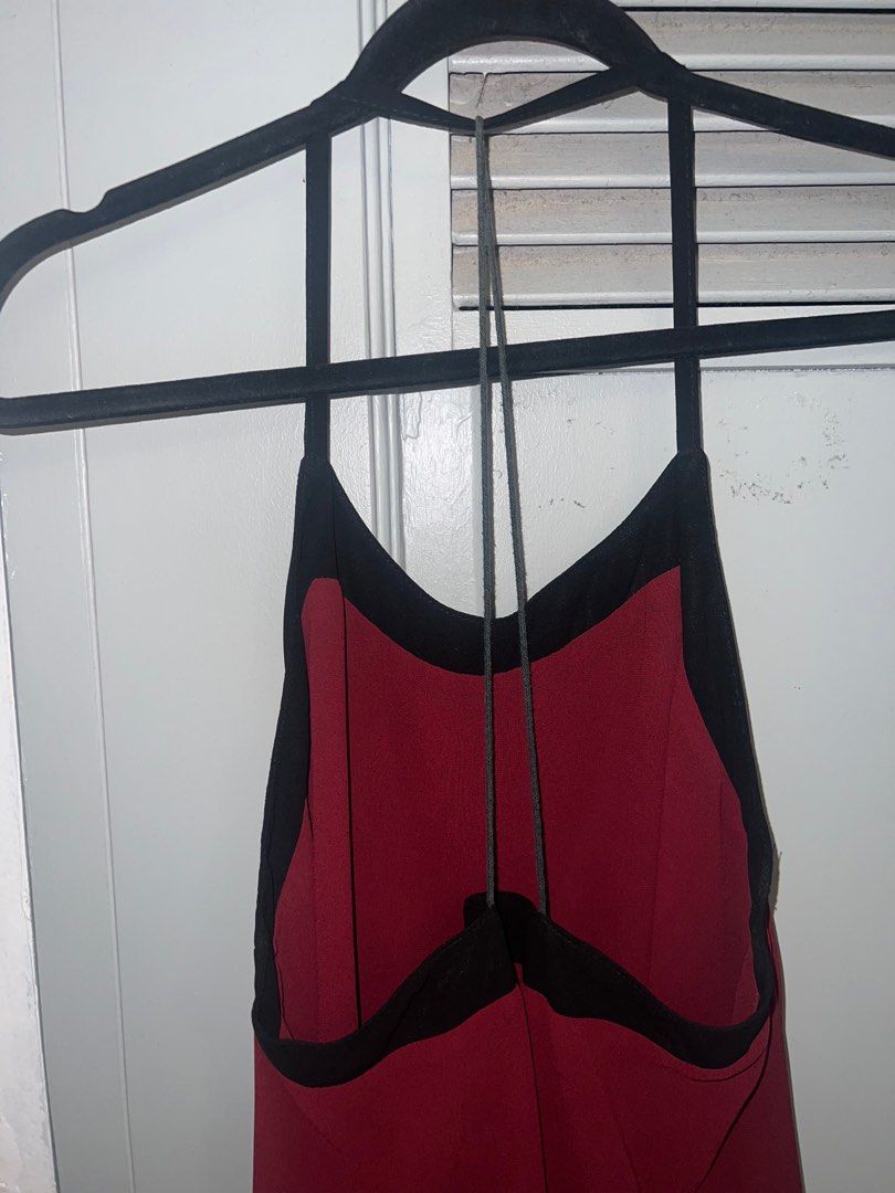 Black & Red Strappy Backless Halter Top (Category: Longsleeves) located in Pasig City. Submitted by lbclosetcleanup (Listing ID 1360237568, Image 3). Description: Flaw is the strap at back is faded Fits M best, loose.