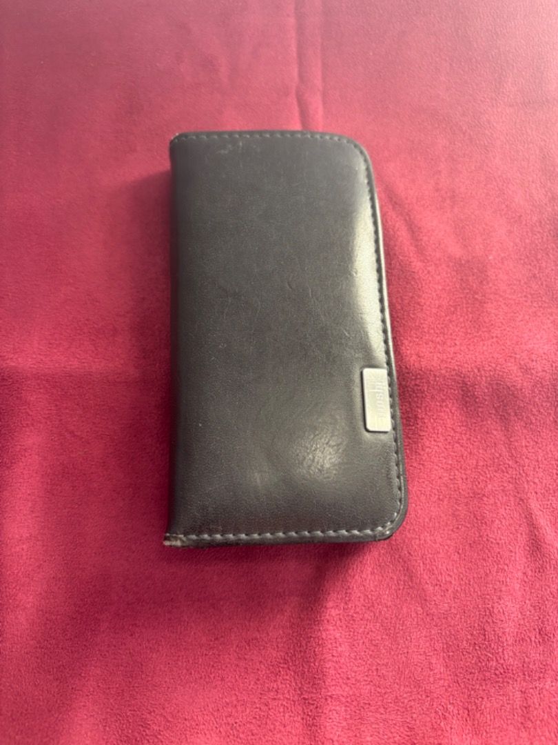 Black MOSHI OVERTURE Wallet-iPhone Case for iPhone 6+/6S/7+/8+ (Category: Cases & Sleeves) located in Manila. Submitted by blissful_bargain_bazaar (Listing ID 1360316115, Image 3). Description: The Black MOSHI OVERTURE Wallet-iPhone Case for iPhone 6+/6S/7+/8+ is compatible with most iPhones from 6 to 8. It will be sold as is without additional repairs, well used, with only minor stitching wear and tear and case deterioration with some cracks and