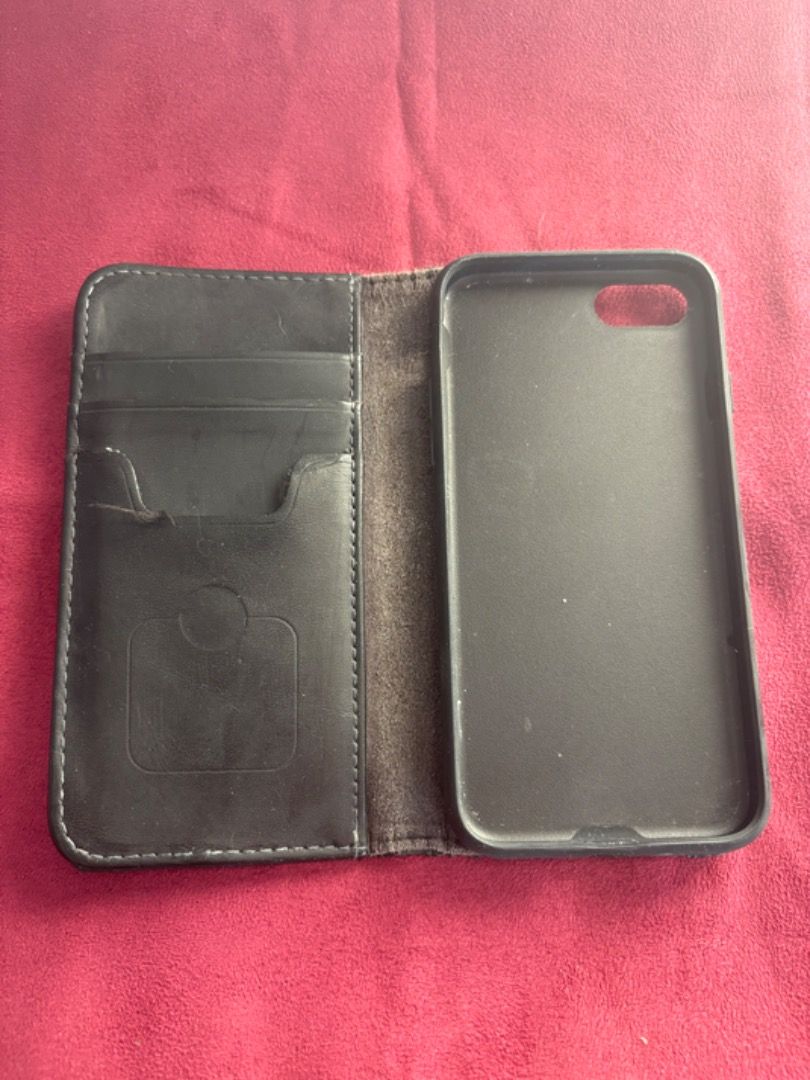 Black MOSHI OVERTURE Wallet-iPhone Case for iPhone 6+/6S/7+/8+ (Category: Cases & Sleeves) located in Manila. Submitted by blissful_bargain_bazaar (Listing ID 1360316115, Image 1). Description: The Black MOSHI OVERTURE Wallet-iPhone Case for iPhone 6+/6S/7+/8+ is compatible with most iPhones from 6 to 8. It will be sold as is without additional repairs, well used, with only minor stitching wear and tear and case deterioration with some cracks and