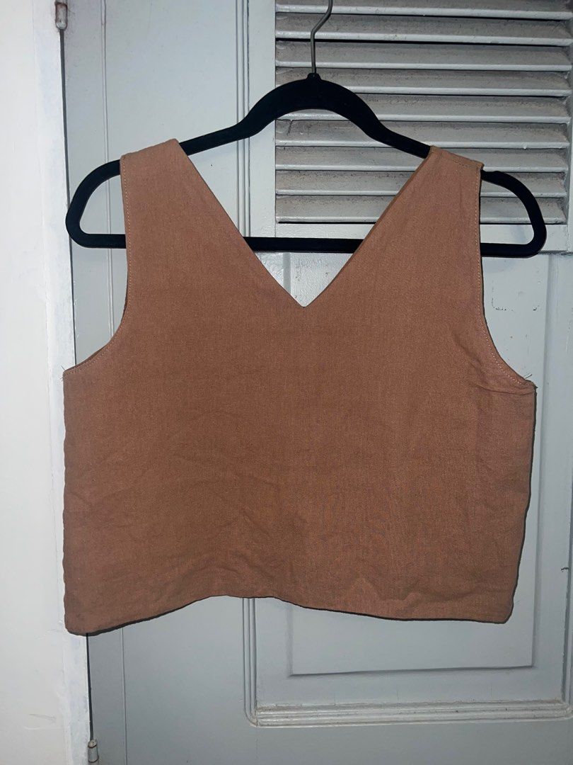 Brown Reversible Linen Boxy Crop Top (Category: Sleeveless) located in Pasig City. Submitted by lbclosetcleanup (Listing ID 1360237962, Image 1). Description: Tried on only Can be worn 4 ways, reversible Fits M best.