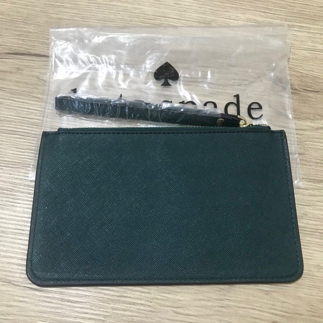 KATE SPADE - WRISTLET (DARK GREEN) (Category: Luxury Bags & Wallets) located in Dasmarinas. Submitted by pseudonym. (Listing ID 1360304927, Image 2). Description: KATE SPADE - DARK GREEN LEATHER WRISTLET YKK ZIPPER NEW WITH PLASTIC PACKAGING CAN EASILY FIT IPHONE feel free to ask quick replies .