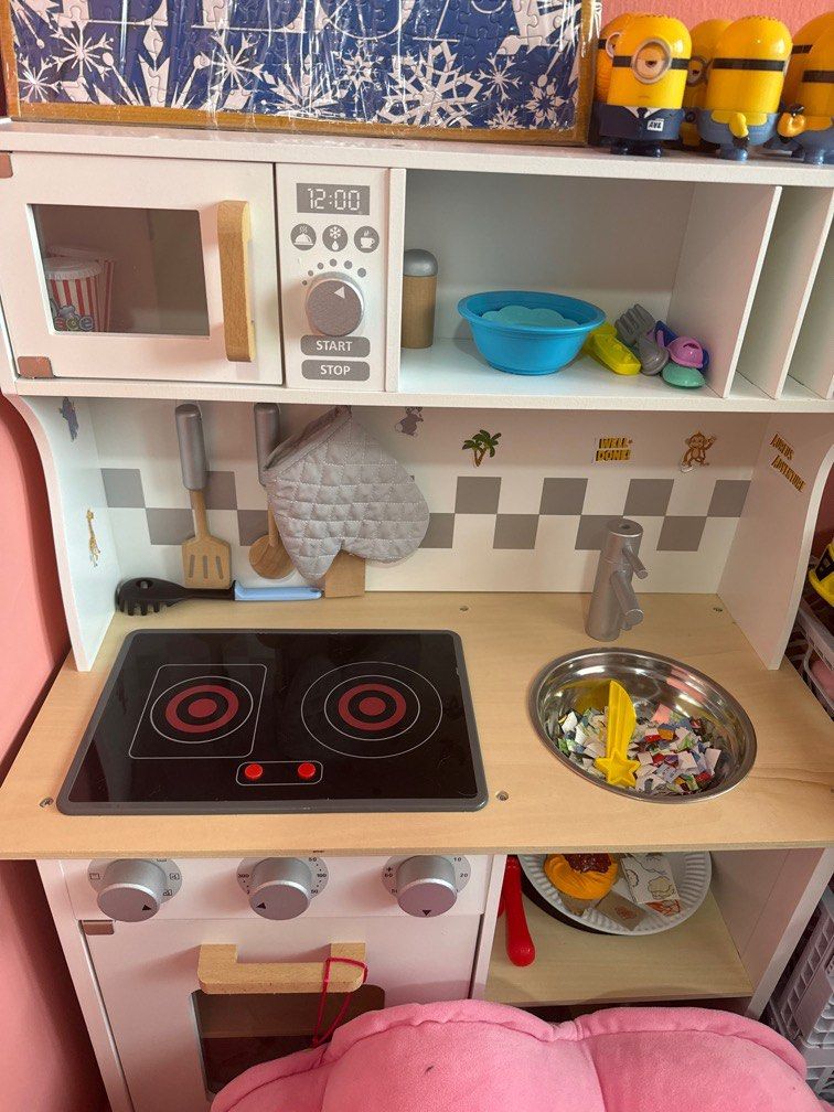 Kitchen set (Category: Interactive Toys) located in Singapore. Submitted by meaniie (Listing ID 1360296347, Image 1). Description: Wooden kitchen with functional light up stove. Also have sound, but need to change the battery. Comes with the wooden utensils and will give away anything kitchen related food..