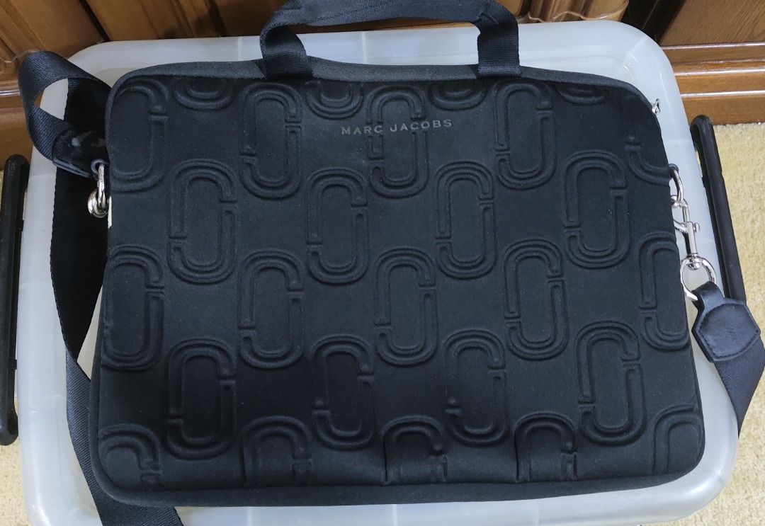 Marc Jacobs Double J Neoprene 13" Commuter Case (Category: Luxury Bags & Wallets) located in Quezon City. Submitted by outoftheboxph (Listing ID 1360351931, Image 3). Description: RFS: Decluttering Issues: leather fading on the strap as shown in the last photo Measurements: 34 cm W x 25 cm H x 3 cm D. Manufacturer Style No. M0010337 Material: Neoprene Take your files on the go with the Marc Jacobs Double J Neoprene 33 cm (13") Commuter Case. Feat