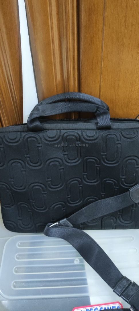 Marc Jacobs Double J Neoprene 13" Commuter Case (Category: Luxury Bags & Wallets) located in Quezon City. Submitted by outoftheboxph (Listing ID 1360351931, Image 2). Description: RFS: Decluttering Issues: leather fading on the strap as shown in the last photo Measurements: 34 cm W x 25 cm H x 3 cm D. Manufacturer Style No. M0010337 Material: Neoprene Take your files on the go with the Marc Jacobs Double J Neoprene 33 cm (13") Commuter Case. Feat