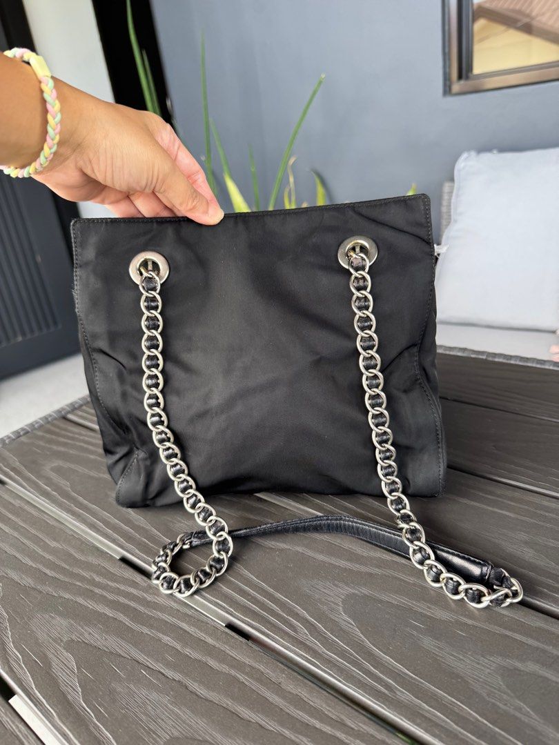Pr@da Chain Bag (Category: Luxury Bags & Wallets) located in Pasig City. Submitted by denzlrio (Listing ID 1360335982, Image 3). Description: Prada Black Chain Nylon Bag.