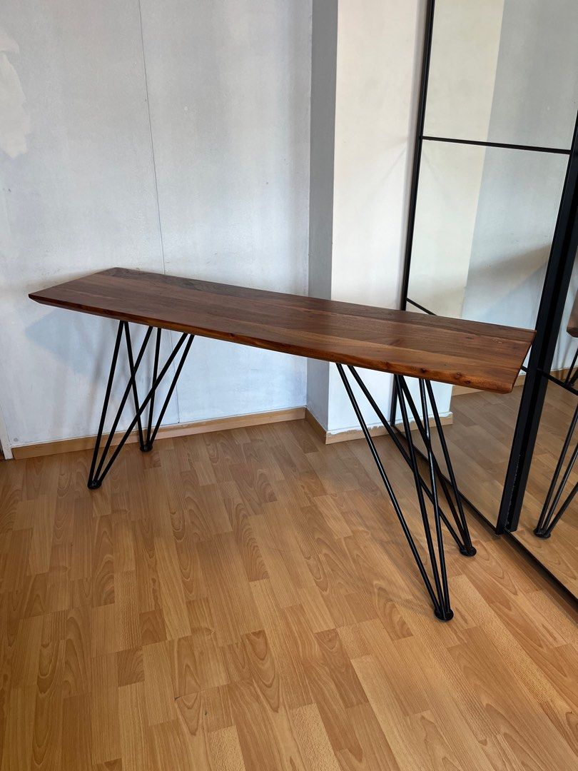 Solid Wood Console Study Table (Category: Tables & Sets) located in Singapore. Submitted by dangoyankee (Listing ID 1360286251, Image 1). Description: features •100% solid acacia hardwood. beautiful grain •recently conditioned the wood •table legs can be micro adjusted to ensure table is sturdy (last pic) •150cm x 41cm x 76cm (LWH) •can be used as a console or study table flaws •minor scratches on the surface that i can’t pick up with my camera, 