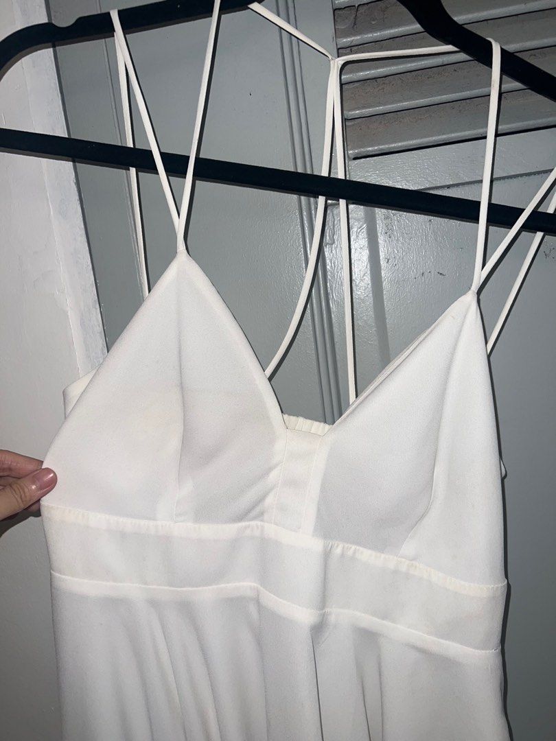 Strappy White Babydoll Top (Category: Sleeveless) located in Pasig City. Submitted by lbclosetcleanup (Listing ID 1360237035, Image 2). Description: Garterized back Zipper at side Needs washing Fits S-M.