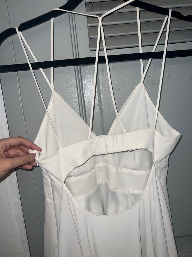 Strappy White Babydoll Top (Category: Sleeveless) located in Pasig City. Submitted by lbclosetcleanup (Listing ID 1360237035, Image 3). Description: Garterized back Zipper at side Needs washing Fits S-M.