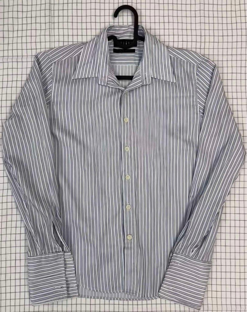 TIELINE Polo shirt longsleeves (Category: Tshirts & Polo Shirts ) located in Quezon City. Submitted by sugoo_ (Listing ID 1360377076, Image 2). Description: TIELINE Polo shirt longsleeves - stripes boue and white formla shirt - In good condition - Issue: missing button on one side of the sleeves Dimensions: Size: Medium on tag Width - 17.5 inches Length - 26 inches .