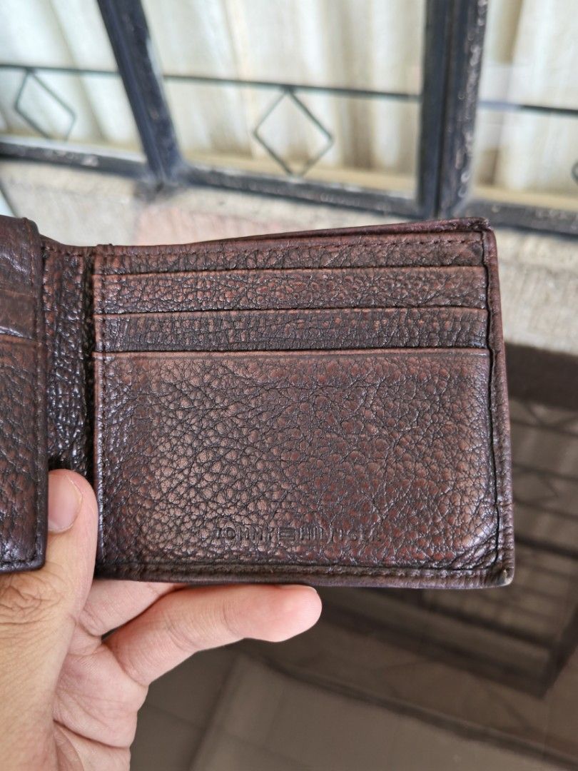 Tommy Hilfiger Men's Wallet Leather (Category: Wallets & Card Holders) located in Quezon City. Submitted by ps.thriftopia (Listing ID 1360280923, Image 2). Description: 100% Genuine Cow Leather only. Well used for several years, hindi nasisira. May signs of usage lang but still high quality RFS: Decluttering.
