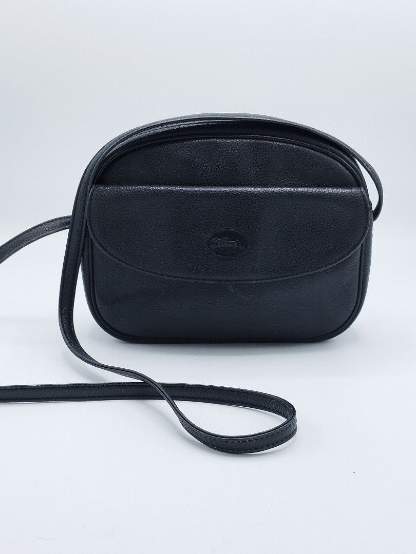 Vintage Longchamp Crossbody bag (Category: Luxury Bags & Wallets) located in Quezon City. Submitted by redragtag (Listing ID 1360298861, Image 1). Description: Authentic, vintage Longchamp bag Made in France Black textured leather with gold-tone hardware. Features a front flap pocket withe snap button closure, zipper top closure for the main compartment, leather lining with 1 big open pocket, exterior zipper pocket on the back. Measurements: Heig