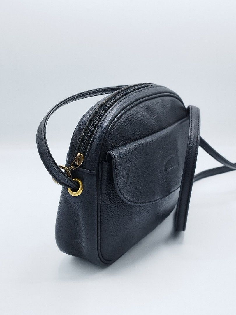 Vintage Longchamp Crossbody bag (Category: Luxury Bags & Wallets) located in Quezon City. Submitted by redragtag (Listing ID 1360298861, Image 3). Description: Authentic, vintage Longchamp bag Made in France Black textured leather with gold-tone hardware. Features a front flap pocket withe snap button closure, zipper top closure for the main compartment, leather lining with 1 big open pocket, exterior zipper pocket on the back. Measurements: Heig