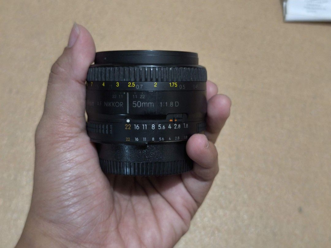 50mm Nikon AF with original box (Category: Lens & Kits) located in Taguig. Submitted by juliestjuly (Listing ID 1360474300, Image 2). Description: with camera cap lens freebie with the original box and manual.