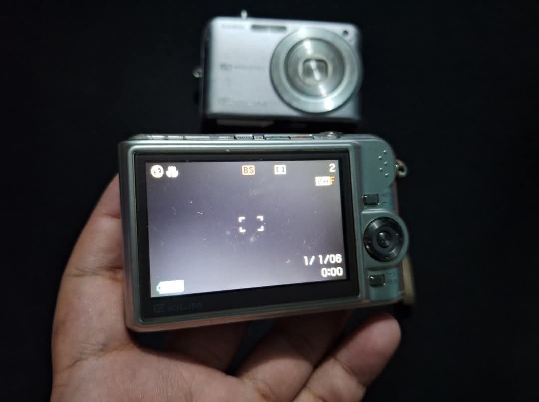 Casio Exilim Digicams (Category: Cameras) located in Quezon City. Submitted by clickph (Listing ID 1360559188, Image 2). Description: Casio Exilim Z1080 and Z1000 Nakakakuha pictures Z1080- basag lang LCD, may kasama nang lcd replacement worth 1600 Z1000- glitch, magandang maganda condition kasama battery, again may kasamang screen replacement na worth 1600 2500 na lang for both, kasama screen saka battery lalamove within ncr, ikaw na mag book.
