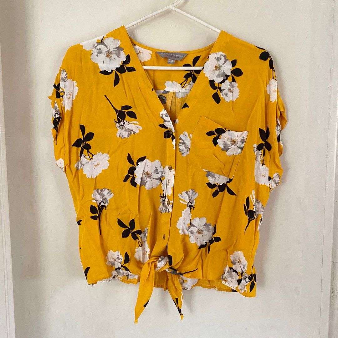 Dorothy Perkins Tie-Front Top (Category: Blouses) located in Quezon City. Submitted by nikknacks (Listing ID 1360402593, Image 1). Description: Dorothy Perkins Tie-Front Top ✅Size: Small (can fit up to XL) ✅Color: Yellow ✅Garment Measurements: Length: 20” Bust: 43” Waist: 42” ✅Lightly used ✅RFS: Decluttering 💰Php 550 ✉️PM if interested .